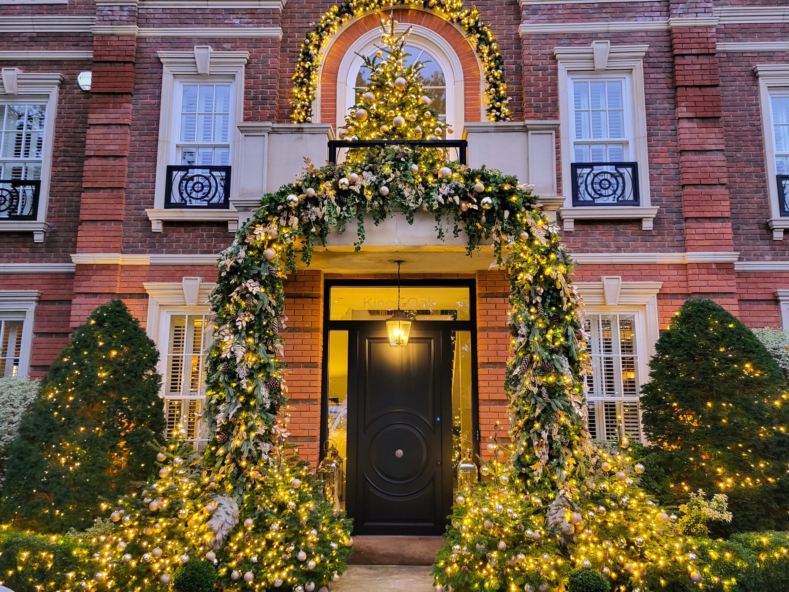 A grand green, gold, and silver themed Festive residential installation. Created for a London based celebrity Christmas 2023.