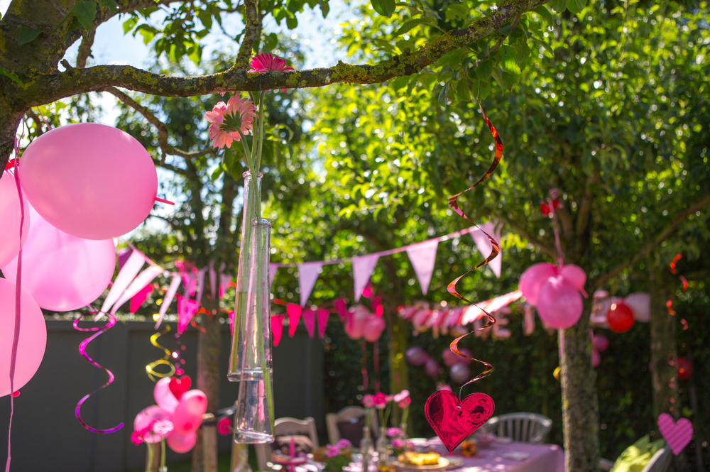 Beautiful purple and pink wedding or love themed garden party and celebration.