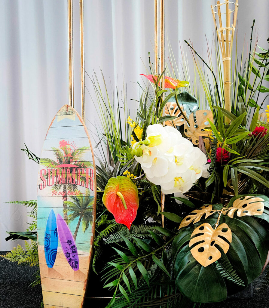 Surfboard and foliage prom decorations